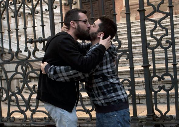 464637715-two-men-kiss-as-they-demonstrate-in-malaga-on-january.jpg.CROP.promo-mediumlarge